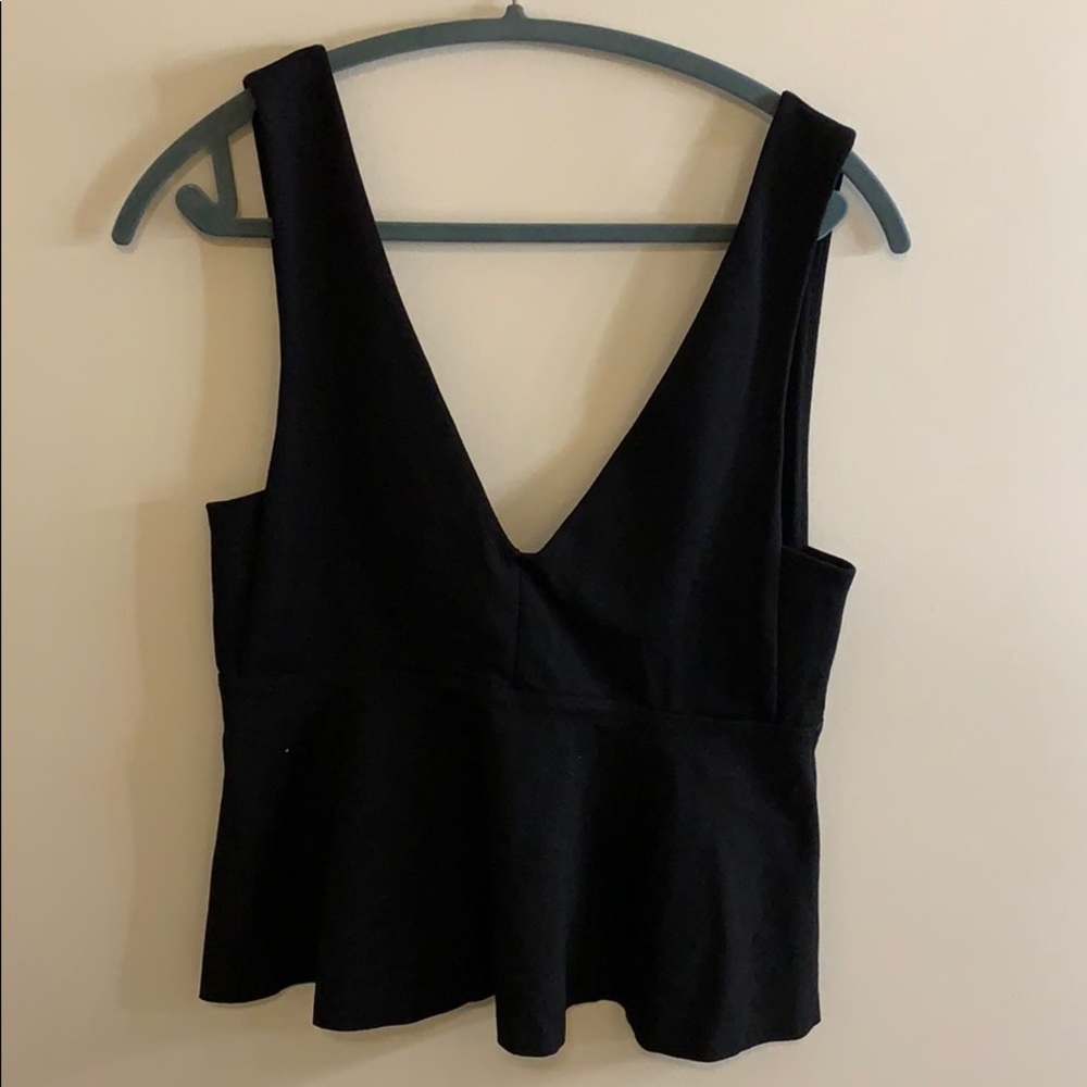 Black top. Cute with jeans or black pants